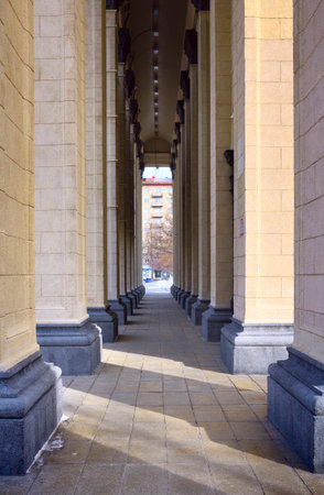 A high colonnade with a stone floor. The entrance portico of the Grand Opera and Ballet Theatre. Novosibirsk, Siberia, Russia, 2022のeditorial素材