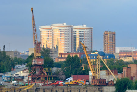 Novosibirsk, Siberia, Russia, 08.20.2022. The capital is on the Ob. Port cranes, new houses in the distanceの写真素材
