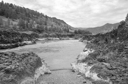 Orocto rapids on the Katuni River. Rocky shores of a mountain river made of volcanic rocks. Altai Republic, Siberia, Russia, 2022の写真素材