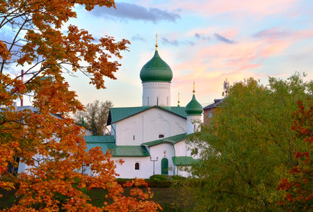 Old Russian temples of Pskov. The Church of the Epiphany of the XV century among autumn trees. Pskov, Russia, 2022の写真素材