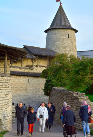 Pskov, Russia, 09/25/2022. The old Pskov Kremlin. Tourists in the defensive corridor at the Trinity Tower, an architectural monument of the XV centuryのeditorial素材