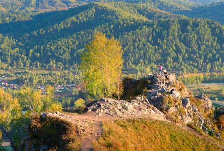 Altai, Siberia, Russia, 09.18.2022. Aya Nature Park in the mountains. The top of the rock of Demons Finger on an autumn eveningのeditorial素材