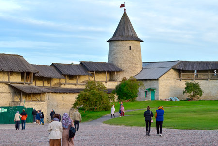 Pskov, Russia, 09/25/2022. The old Pskov Kremlin. Tourists and believers on the Kremlin Square, an architectural monument of the XV centuryのeditorial素材