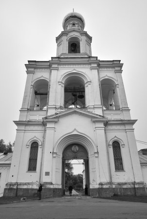 Veliky Novgorod, Russia, 01/10/2022. The St. George Monastery for men. The gate under the high bell tower of the 19th centuryのeditorial素材