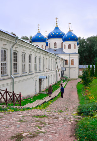 Veliky Novgorod, Russia, 01/10/2022. Orthodox male Yuriev Monastery. The path leading to the Holy Cross Cathedral, a monument of the 19th centuryのeditorial素材