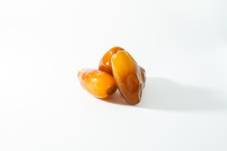 Fresh ripe yellow dates, fresh dates ruthob isolated on white backgroundの写真素材