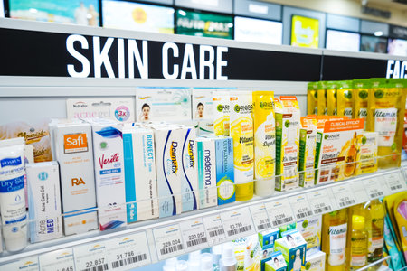 Jakarta, Indonesia, february 16, 2022: Skin care and cosmetics products displayed on shelves in department store. Skin care and makeup products make up the largest share of the world's cosmetic market.のeditorial素材