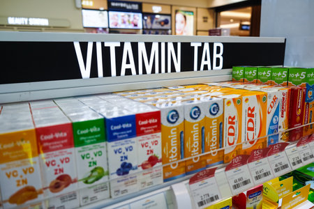 Jakarta, Indonesia, february 16, 2022: Various types of vitamins and supplements on the pharmacy shelf. Drugstore and health care products at Kimia Farma Storeのeditorial素材