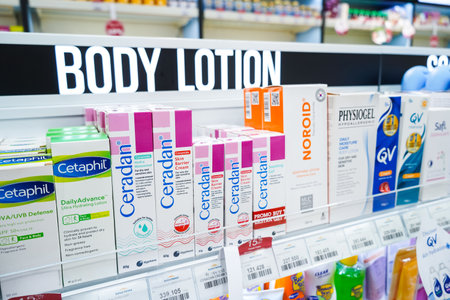 Jakarta, Indonesia, february 16, 2022: body lotion and cosmetics products displayed on shelves in department store. Skin care and makeup products make up the largest share of the world's cosmetic market.のeditorial素材