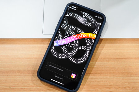 Jakarta, Indonesia, July 12, 2023: threads app logo is visible on the screen. The new application from Meta Platforms is a competitor to Twitter.のeditorial素材