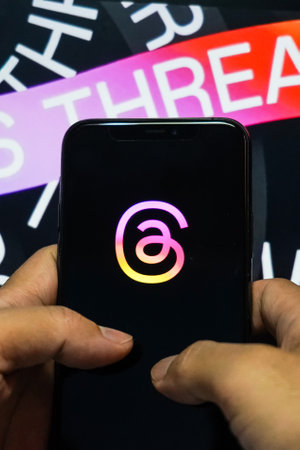 Jakarta, Indonesia, July 12, 2023: threads app logo is visible on the screen. The new application from Meta Platforms is a competitor to Twitter.のeditorial素材