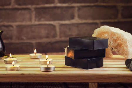 spa, candles, natural organic soaps, plants, natural loofah, towels, fragrance in incense, in a warm...
