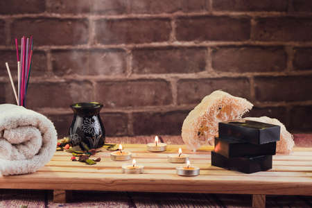 spa, candles, natural organic soaps, plants, natural loofah, towels, fragrance in incense, in a warm place for skin treatmentsの写真素材