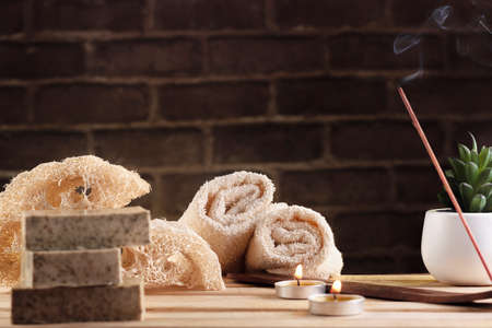 spa, candles, natural organic soaps, plants, natural loofah, towels, fragrance in incense, in a warm place for skin treatmentsの写真素材