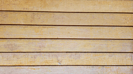 wall of horizontal planks, in wood, painted yellow