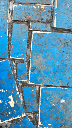 blue tile table, mismatched and dirtyの写真素材