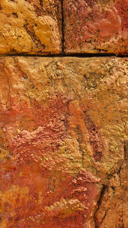 brown and orange sandstone stone wall backgroundの写真素材
