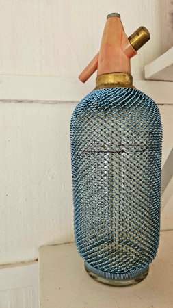 antique siphon, with blue metallic screen and pink detail on the lidの写真素材