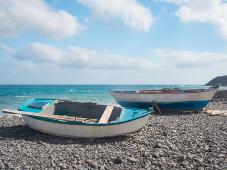 Fishing boats on a stone beach in Pozo Negro, Fuerteventuraの写真素材