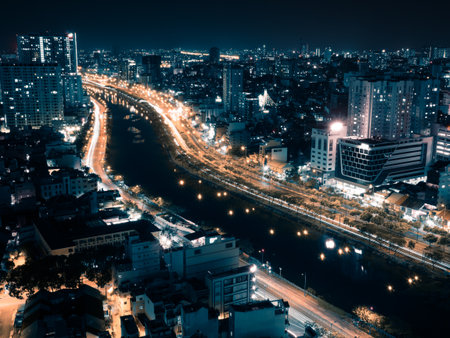 Beautiful top view of Ho Chi Minh City with the river Saigon (SÃ´ng SÃ i GÃ²n), at night