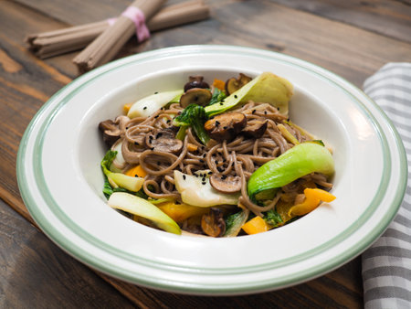 Soba noodle vegetable pan with crunchy pak choi and lemon grass - buckwheat vegetarian noodle dish