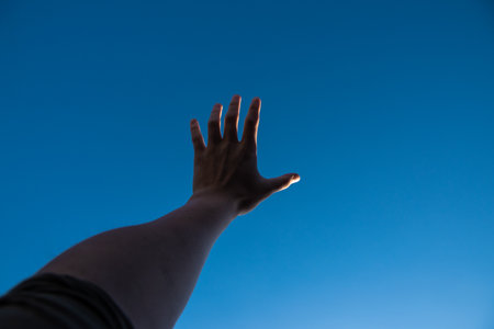 hand on skyの写真素材