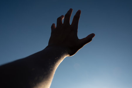 hand on skyの写真素材