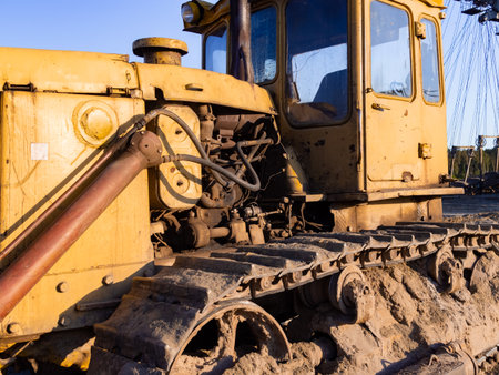 Vintage bulldozer. An abandoned old tractor with sand quarry. Old tractor in the fieldの写真素材