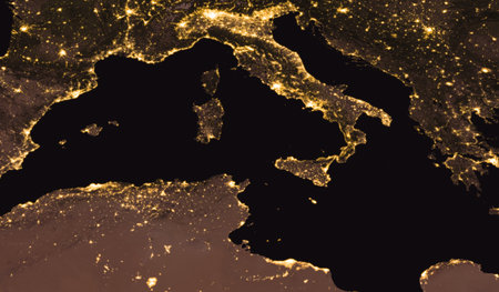 Aerial view of Italy, Sicily, France, Africa, Spain at night. Night view of Europe and North Africa and Tyrrhenian Sea. Elements of this image furnished by NASA.の写真素材