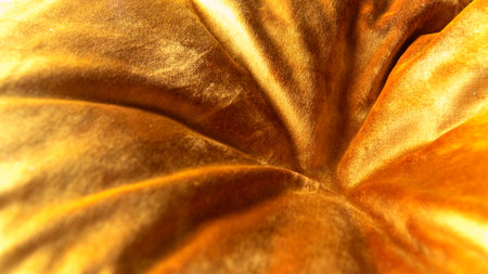 Close-up of fabric texture. Gold color background Yellow abstract patterns on the fabric surface. Softness concept idea background.の写真素材