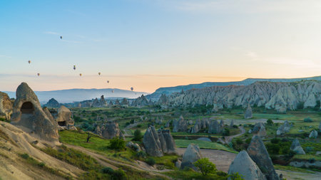 Cappadocia Turkey. Hot air balloons flying over fairy chimneys at sunrise in Cappadocia. Travel to...