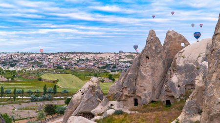Cappadocia. Hot air balloons flying over Cappadocia in a dramatic sky. Travel to Turkey. Selective focus included.の写真素材