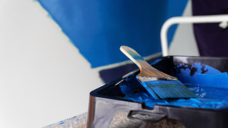 Painting wall. diy concept. Home interior improvement. Renovating house. Do it yourself concept. Selective focus includedの写真素材