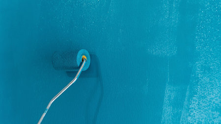 Painting wall. diy concept. Home interior improvement. Renovating house. Do it yourself concept....