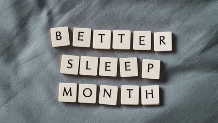 Better sleep month. Better sleep month words on soft bed. High angle view. Selective focus included. Presentation template.の写真素材