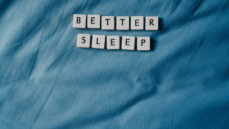 Sleep concept. Better sleep words on bed. Sleep health concept. High angle view. Copy space for text.の写真素材