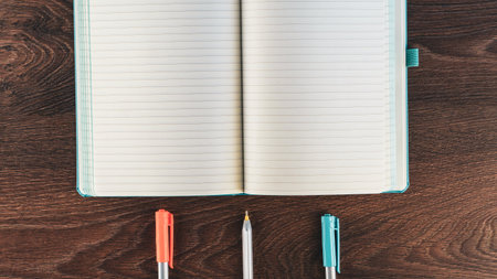 Back to school concept. School supplies on wooden background. Back to school lettering on white letter board. Copy space for text. Selective focus includedの写真素材