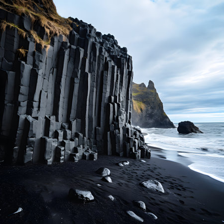 Black Sand Beach with Basalt Columns and Ocean Waves in Icelandの素材