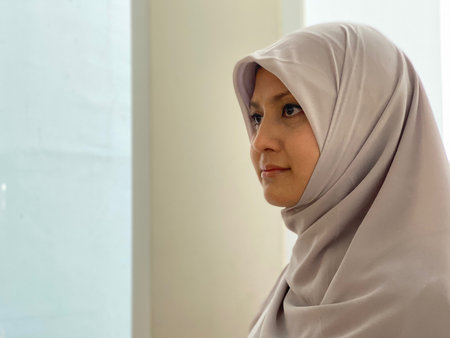 Portrait asian hijab woman standing looking awayの写真素材