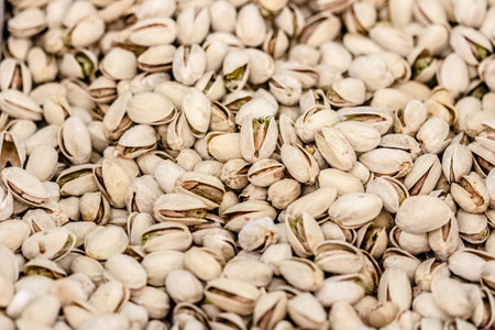 capture of raw pistachio pile at marketの写真素材