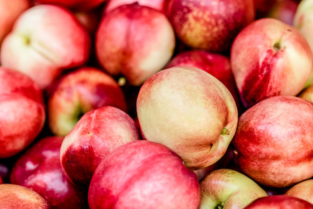capture of colorfull peach pile at the marketの写真素材