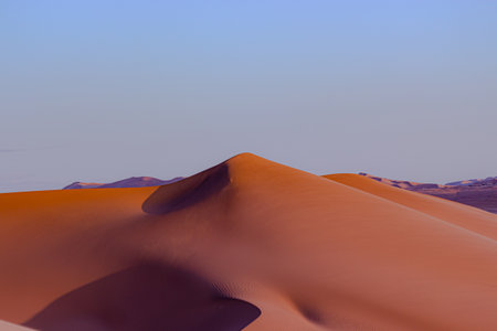 capture of sand dunes in a sunsetの写真素材