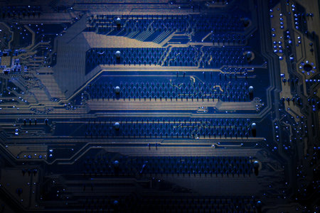 The surface and texture of the back of printed circuit board with shallow depth of field.
