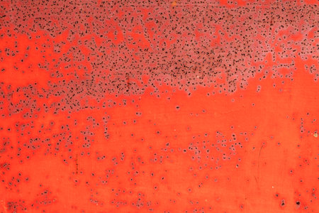 Old metal red painted background with streaks of rust for creativity, textures and backgrounds.