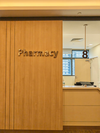 Healthcare pharmacy entrance with reception counter and modern interior design.の写真素材