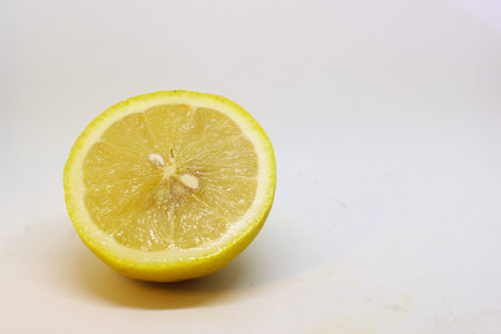 close-up photo of pieces of jerk and lemon with a blurry white backgroundの写真素材