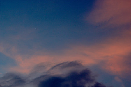 the atmosphere of the evening sky before sunset, with clear skies and clouds that are slightly piled...