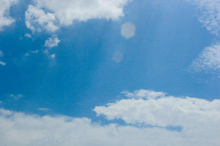 beautiful photos of the blue sky on a clear day with clean white clouds, a combination of blue and white and sparkling sunlight add a sense of enthusiasm for outdoor activitiesの写真素材
