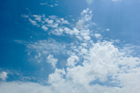 beautiful photos of the blue sky on a clear day with clean white clouds, a combination of blue and white and sparkling sunlight add a sense of enthusiasm for outdoor activitiesの写真素材