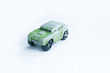 a plastic vehicle toy with a white isolated background, commonly used as a tool to introduce types...